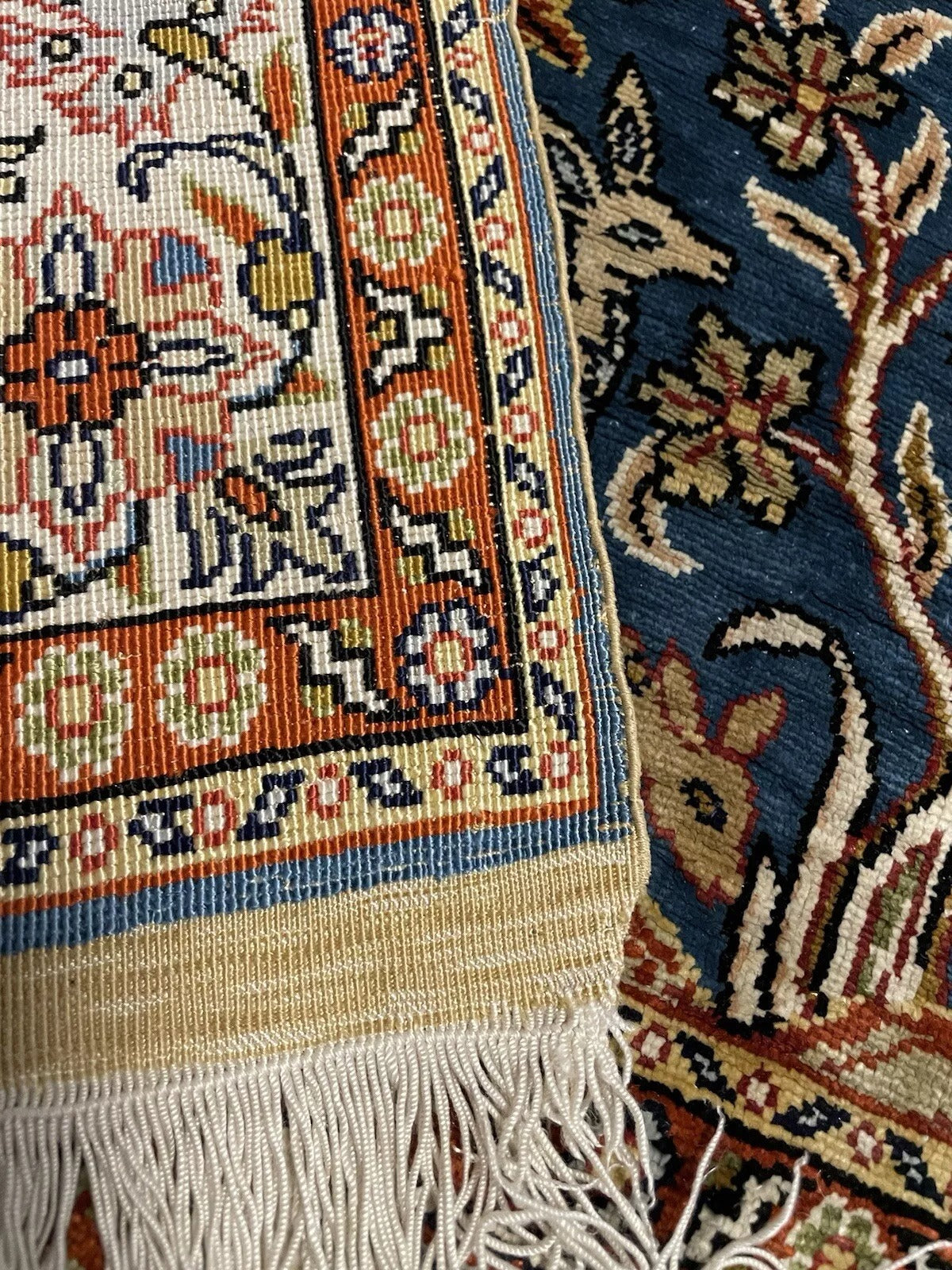Elegant Hereke rug with hand-knotted silk craftsmanship.


