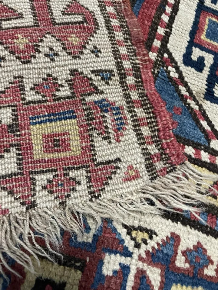 Fine craftsmanship of a vintage Genje rug with ethnic patterns.

