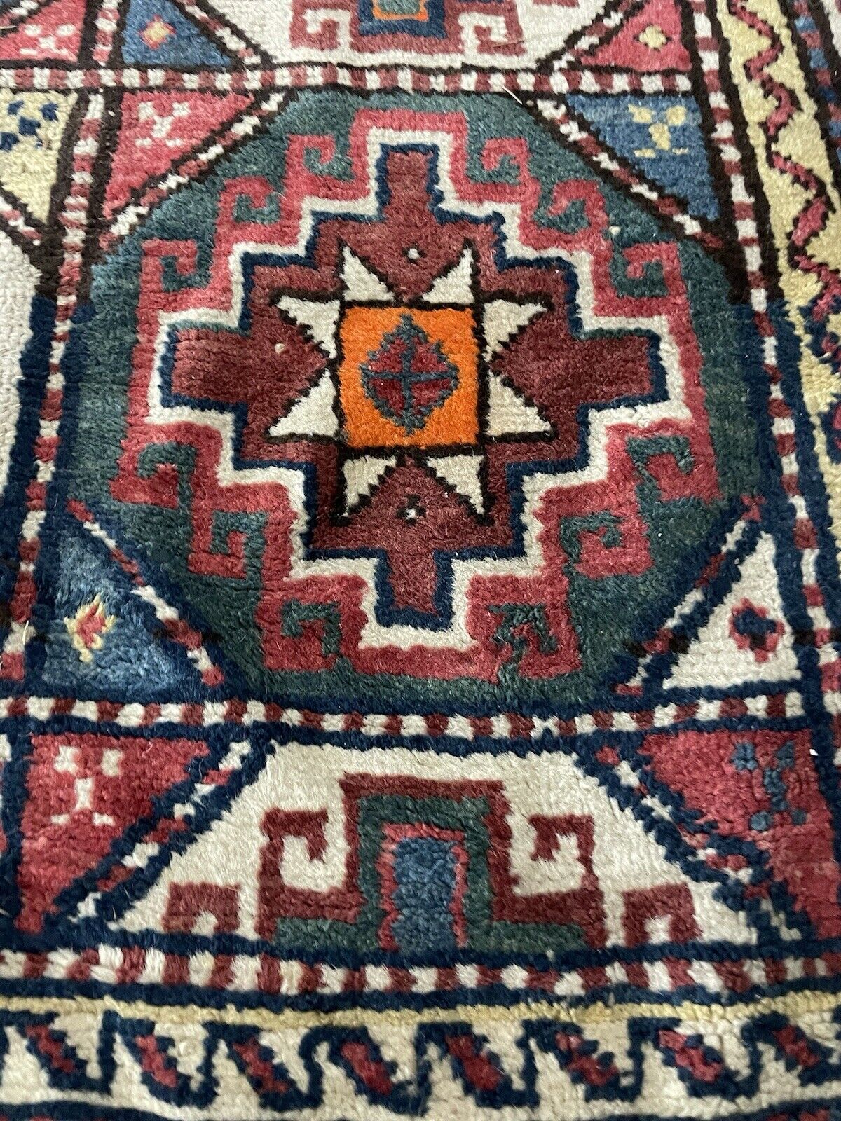 Handwoven antique rug featuring timeless geometric designs.

