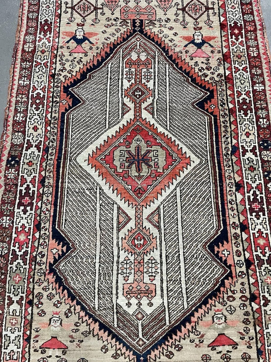 Close‑up of diagonal boteh pattern on antique Seraband rug


