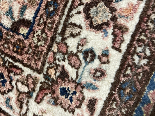 Close-up of geometric medallions in vintage wool runner


