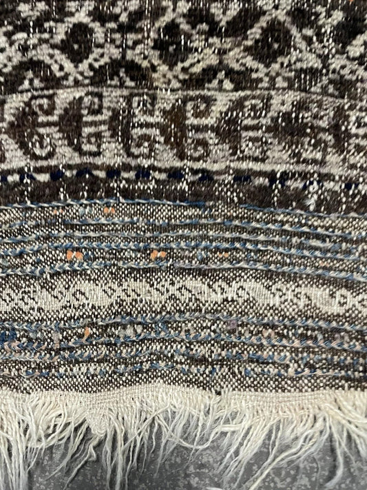 Small tribal rug with stepped geometric Baluč motifs

