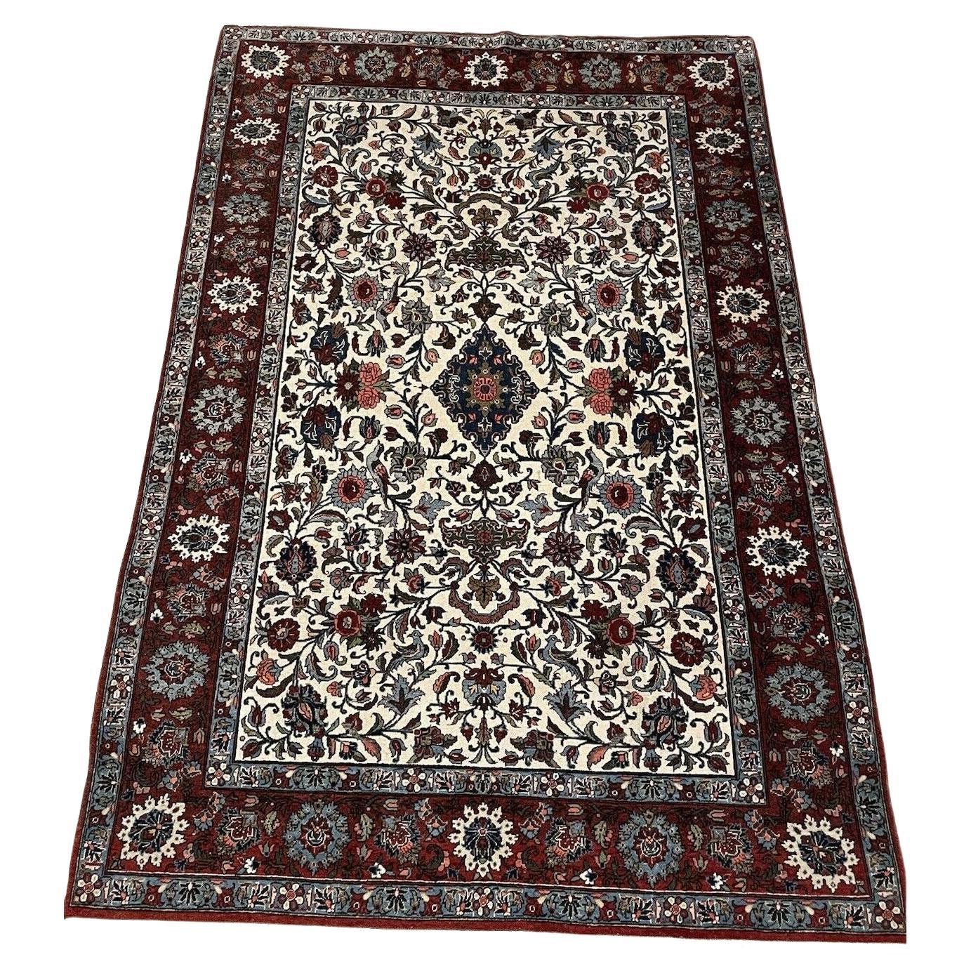 Antique Persian Malayer rug in navy blue with floral design

