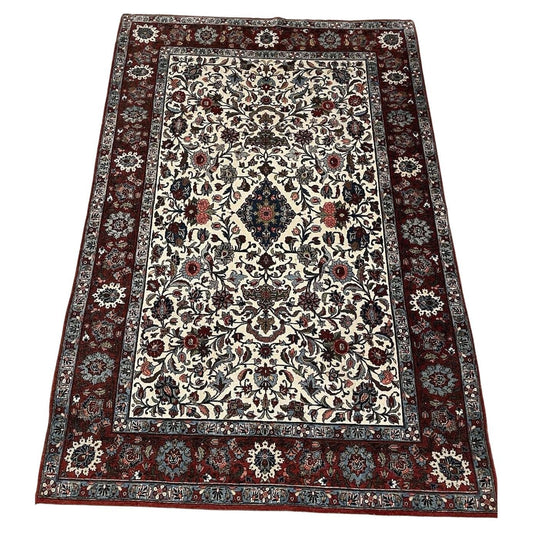 Antique Persian Malayer rug in navy blue with floral design

