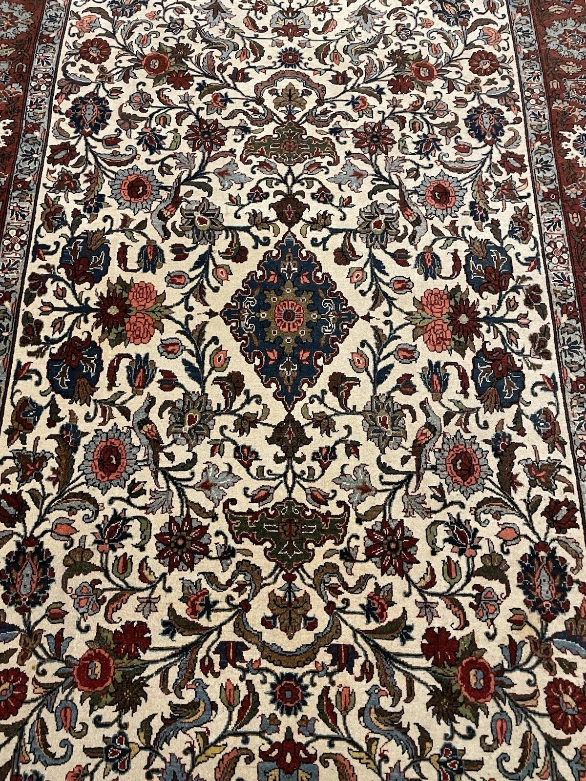 Detailed corner view of Malayer rug border

