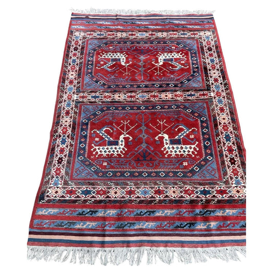 Vintage Yörük rug in deep red with animal motif

