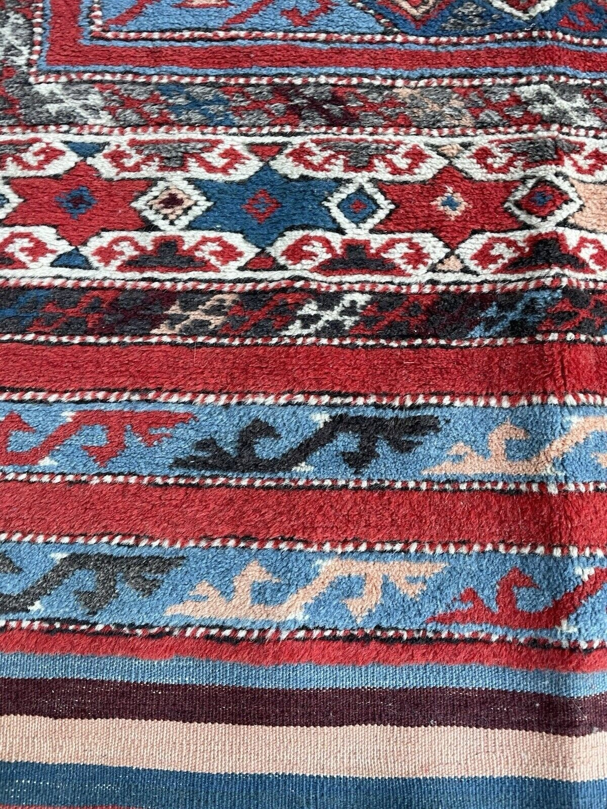 Stylized border weave in layered geometric shapes

