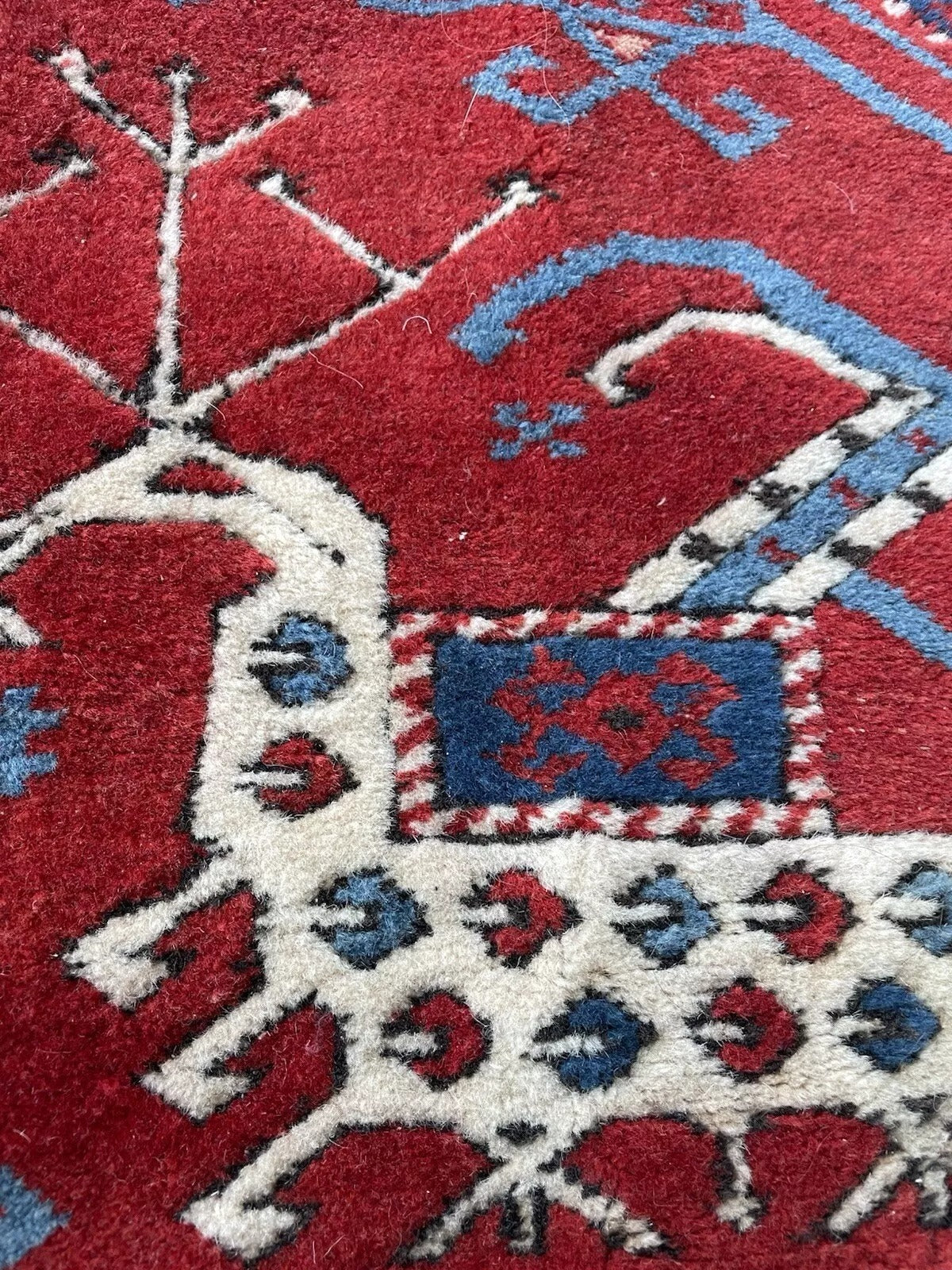 Intricate tribal geometric weaving in hand-knotted wool

