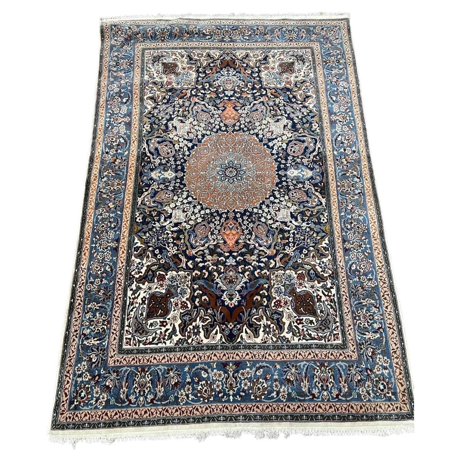 Vintage Persian Isfahan rug with central medallion design

