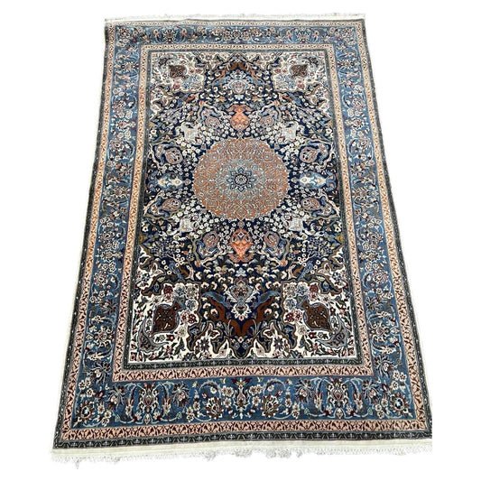 Vintage Persian Isfahan rug with central medallion design

