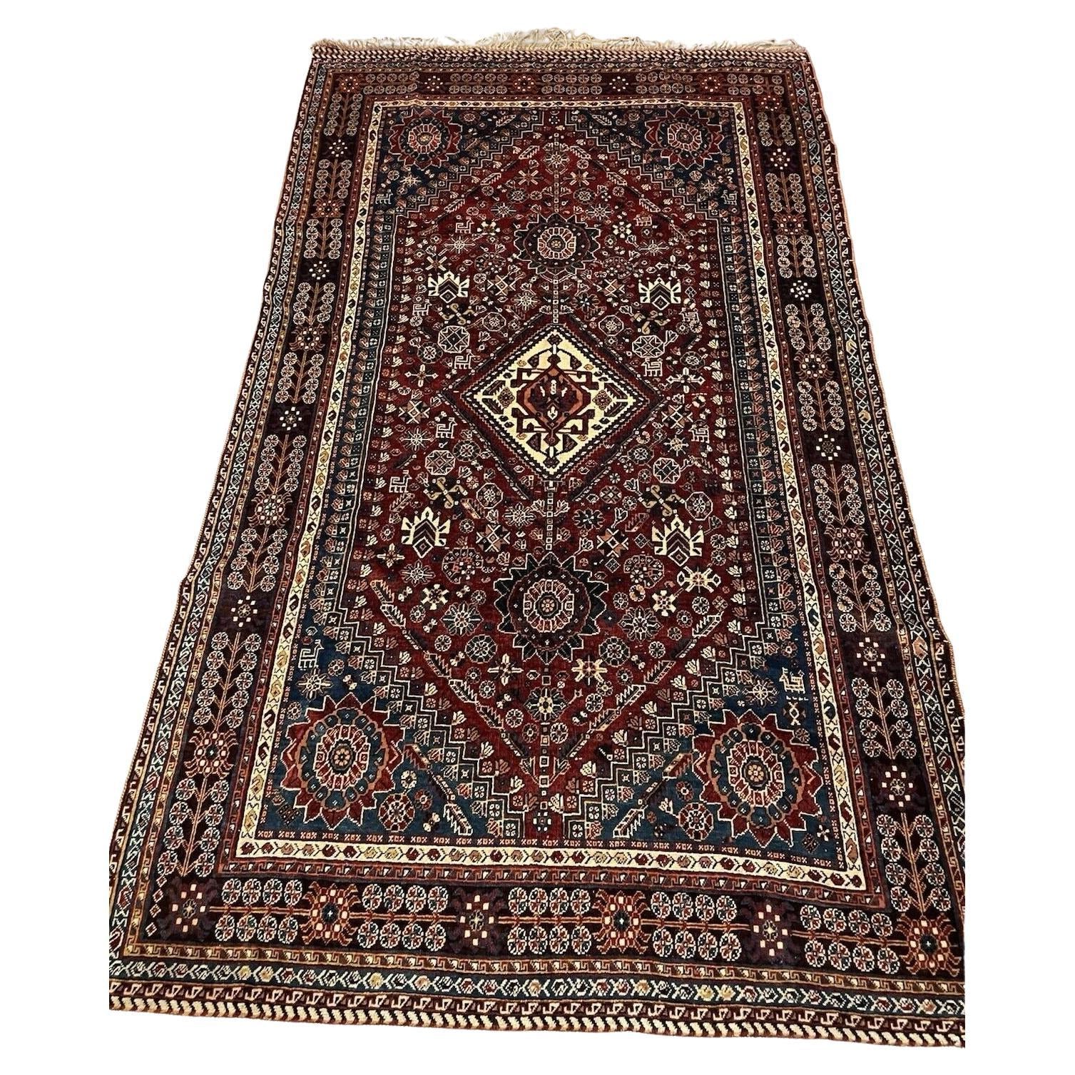 Antique Persian Gashkai rug with bold medallion design


