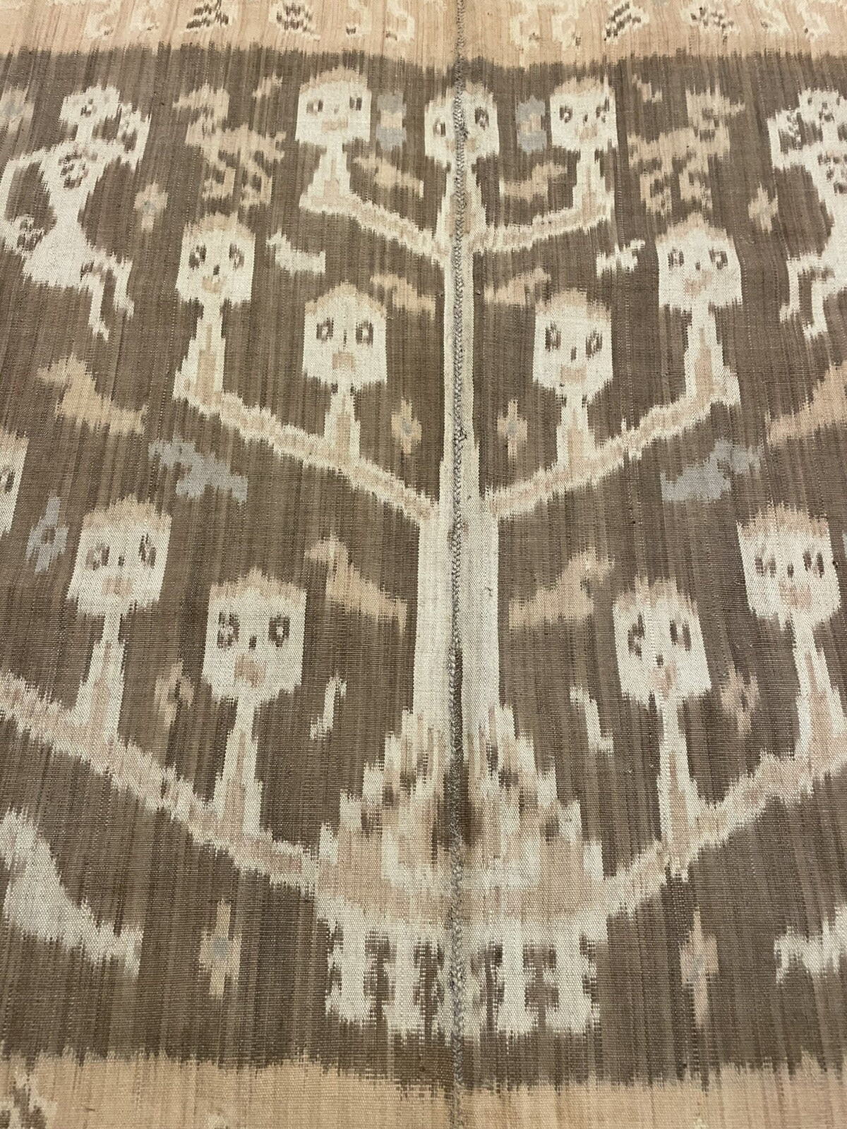 Full perspective of a rare Sumba ancestor cloth displayed on a wall, demonstrating its presence as a museum-quality ethnographic textile and significant work of non-Western art measuring 8 feet 3 inches long.

