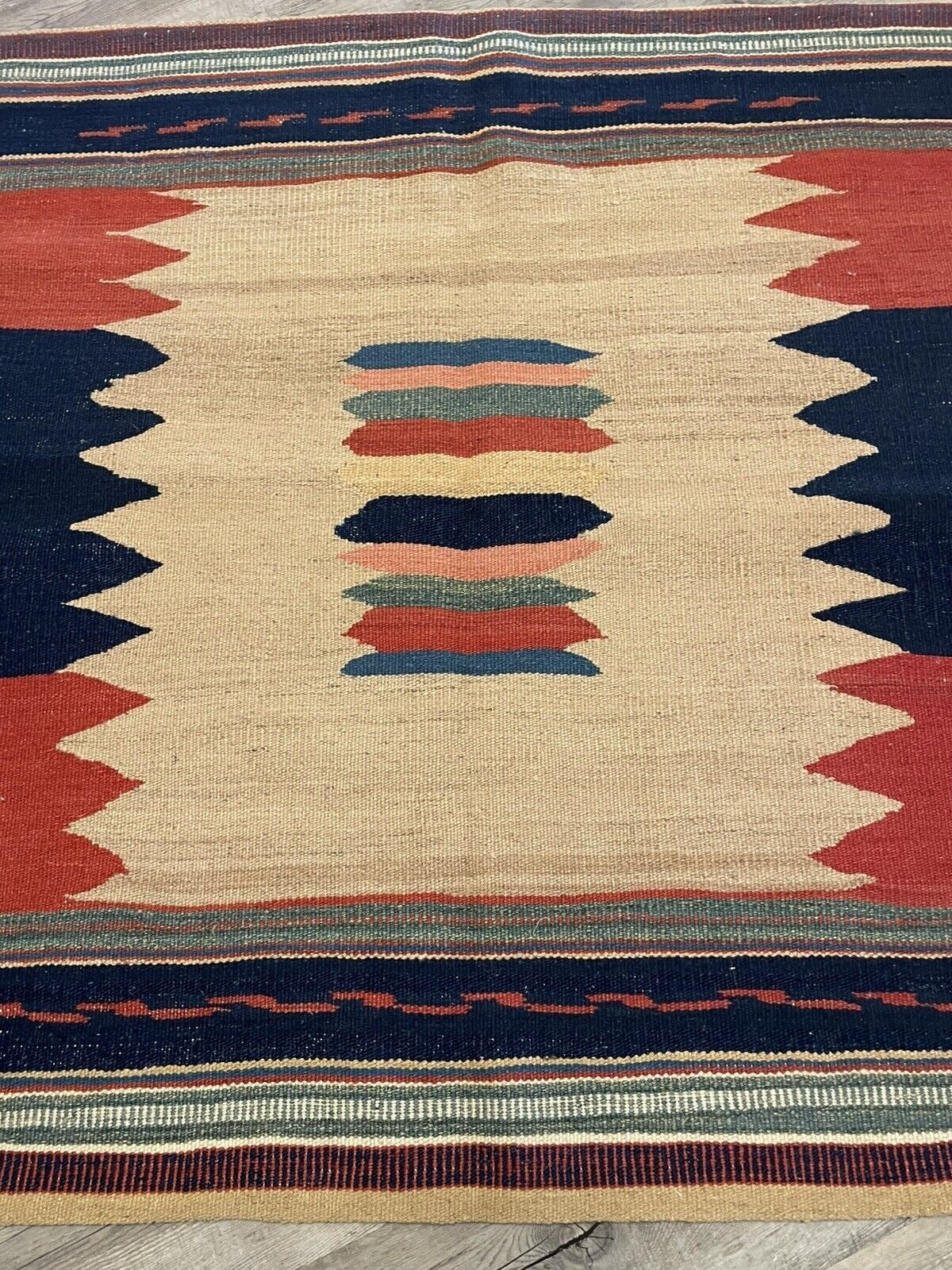 Symmetrical medallion pattern on kilim surface

