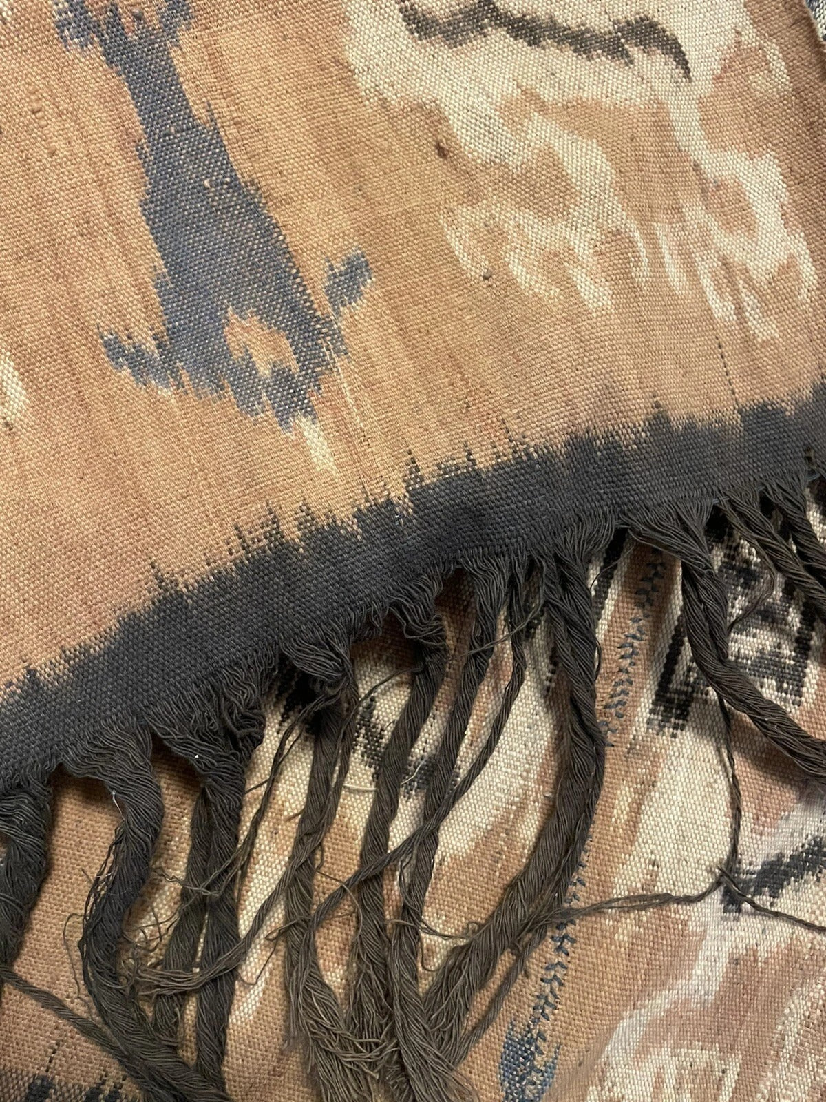 Detail of horse motif in beige and brown dye bands
