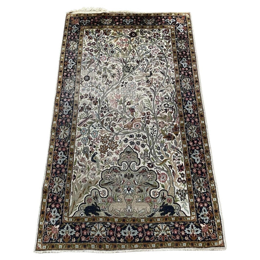 Full top view of the antique Indian Agra rug showing the complete Tree of Life design.

