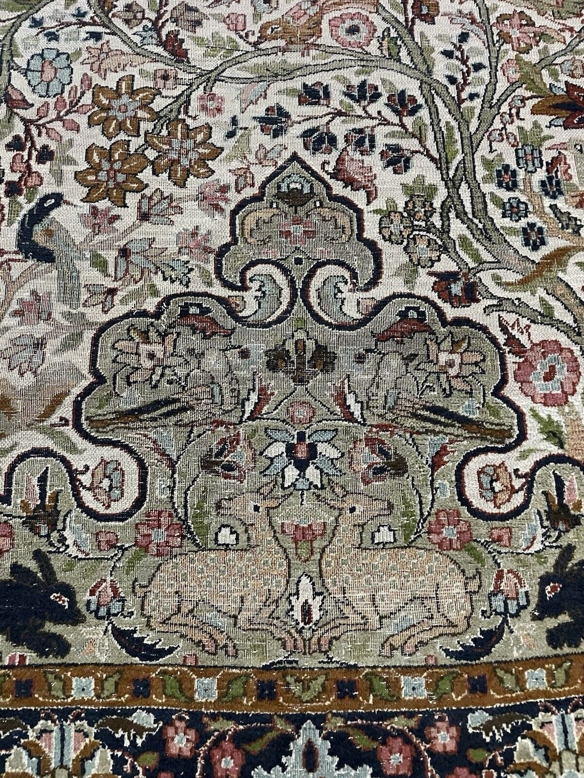 A section of the field displaying the soft ivory and beige background tones.

