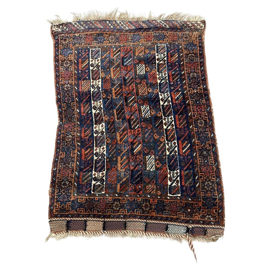 Full top view of the antique Afghan Baluch rug showing the complete repeating geometric pattern.

