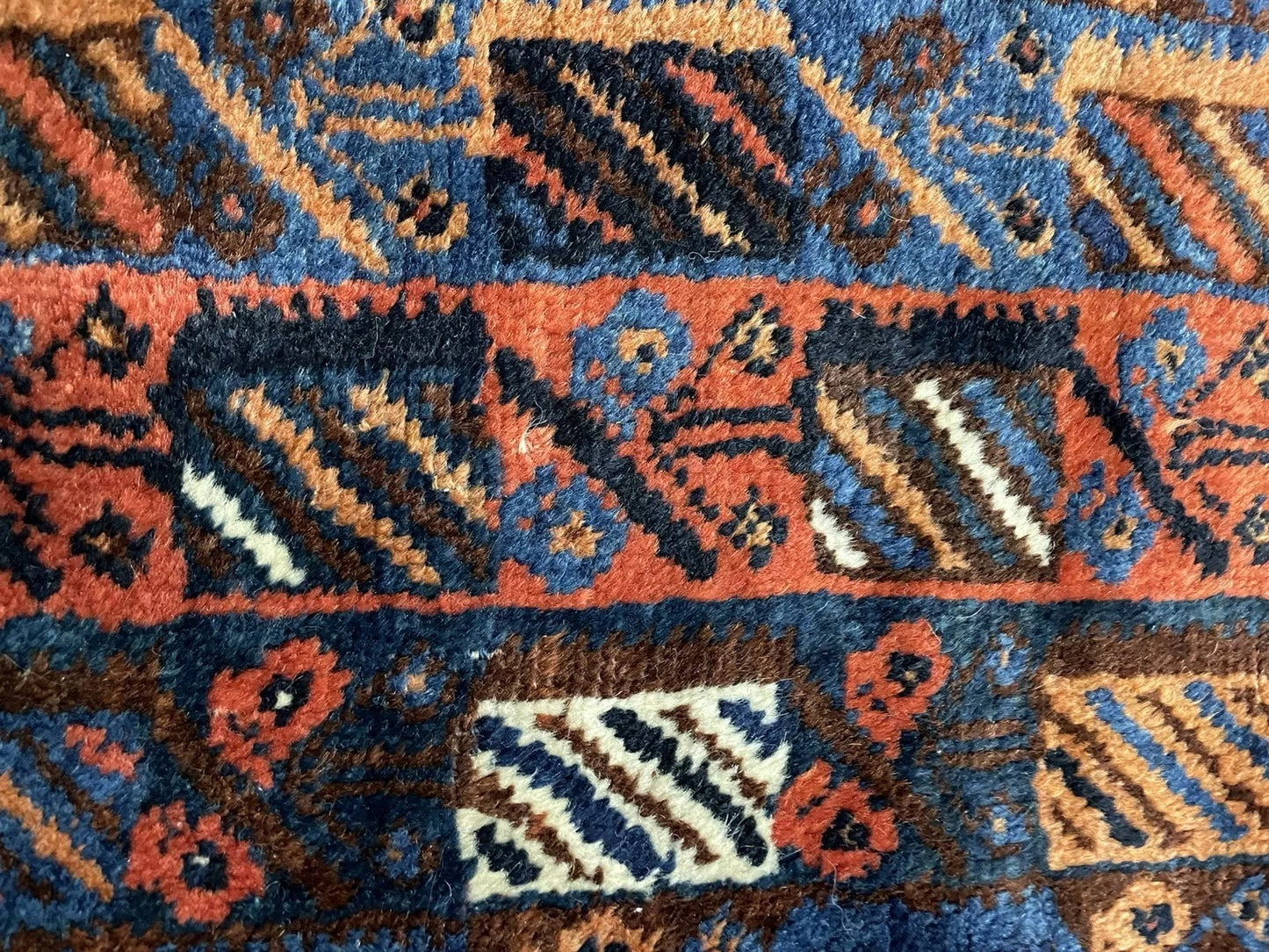 Close-up focusing on the dark green and ivory accent colors within the design.

