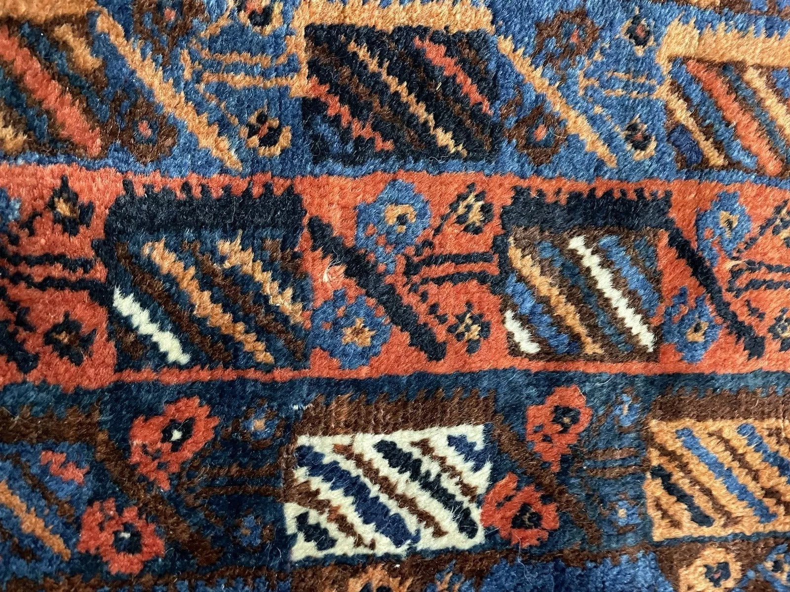 Close-up focusing on the dark green and ivory accent colors within the design.

