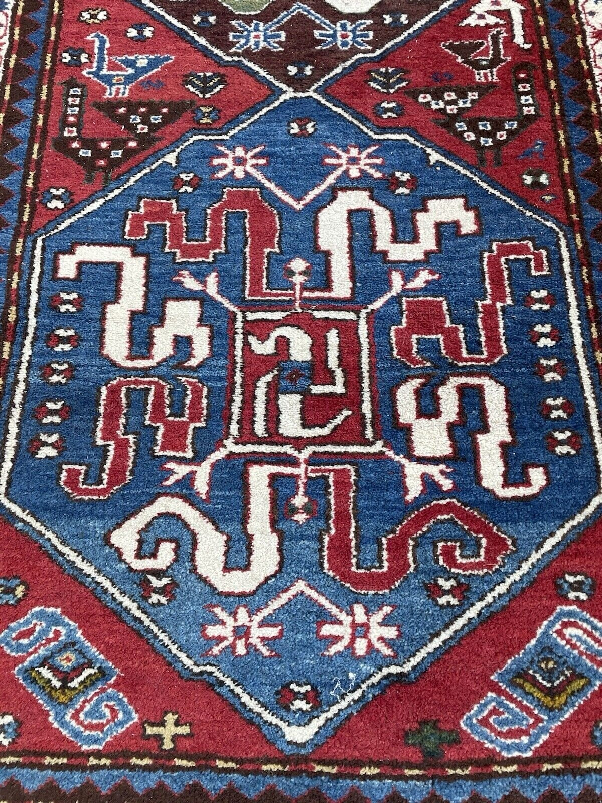 A section of the border displaying the rhythmic repetition of its geometric elements.

