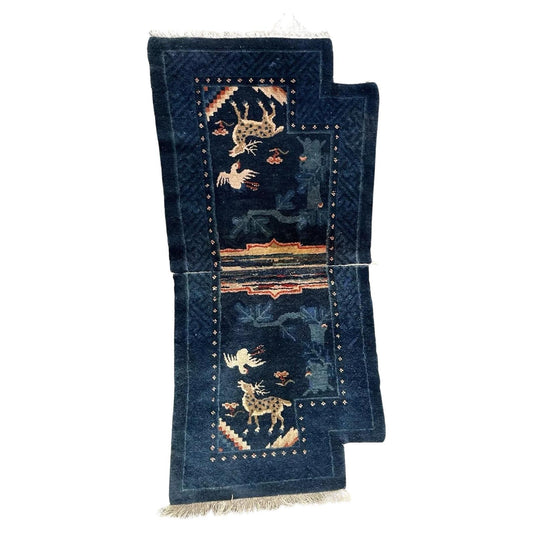 Full top view of the antique Chinese Pao Tao rug showing the deep blue field and central panel.


