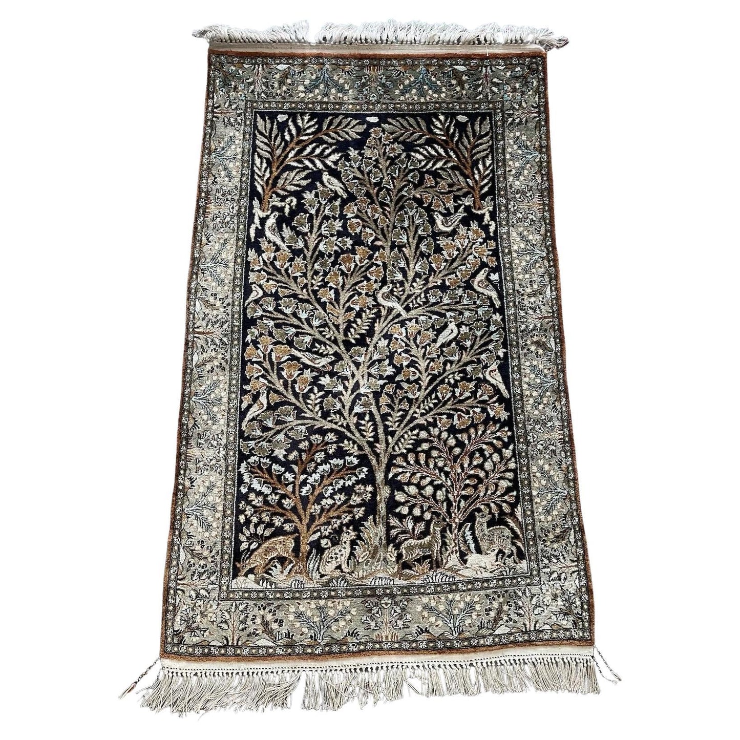 Full top view of the vintage Persian Qum silk rug showing the entire Tree of Life design.

