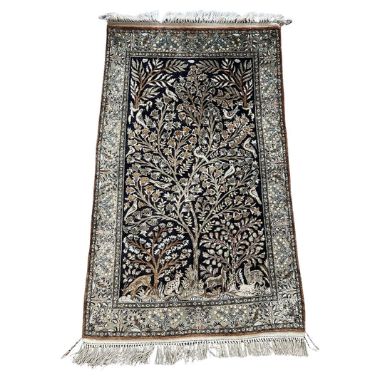 Full top view of the vintage Persian Qum silk rug showing the entire Tree of Life design.

