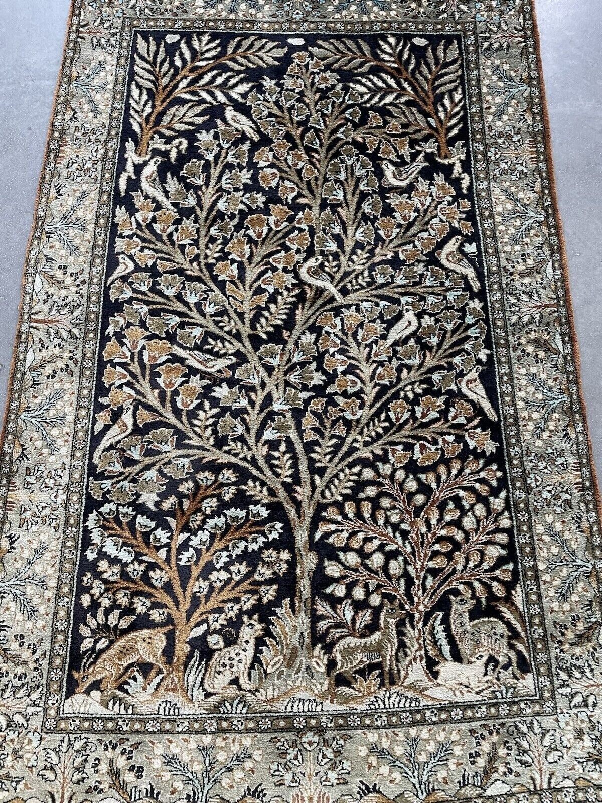 Detail of the silk's lustrous texture and the vibrant color palette.

