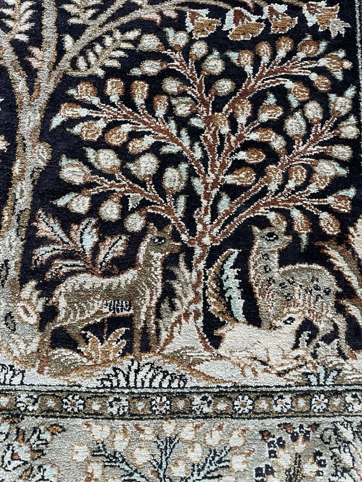 Close-up highlighting the incredible precision of the hand-knotted silk threads.

