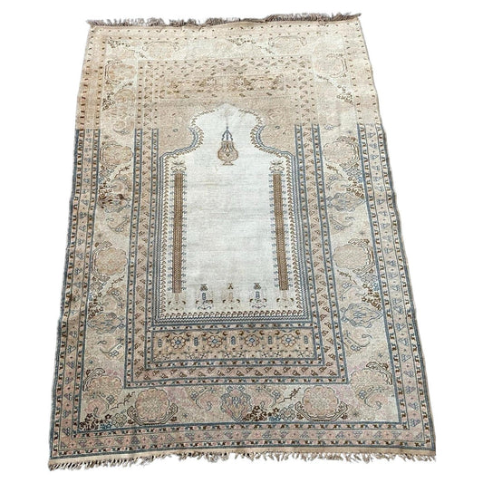 Full top view of the antique Turkish Ghurdes prayer rug showing the complete mihrab design.

