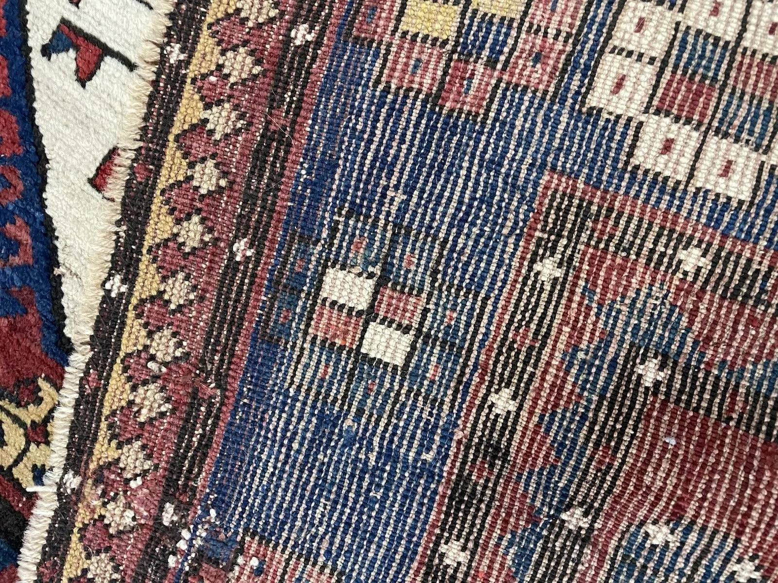 Close-up on the beautiful patina and minor age-related wear on the wool.

