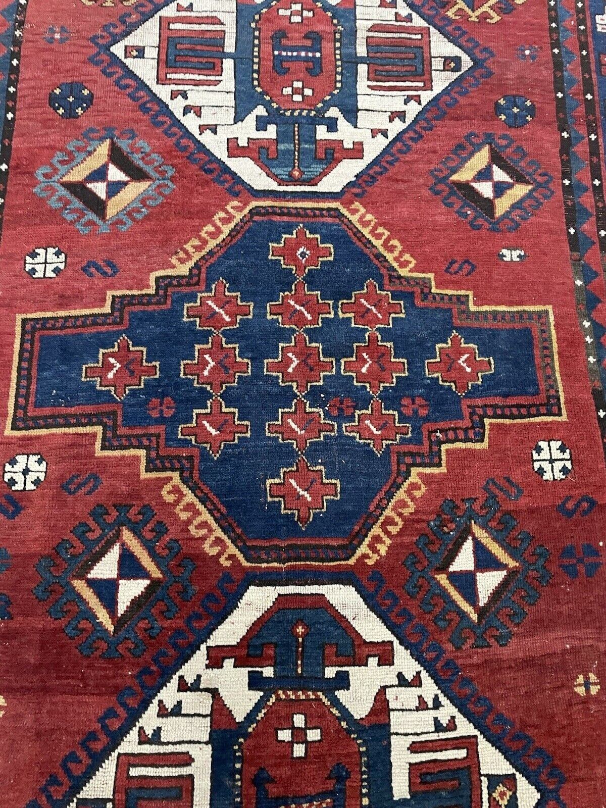 Close-up showcasing the intricate knotting and weaving of the tribal patterns.

