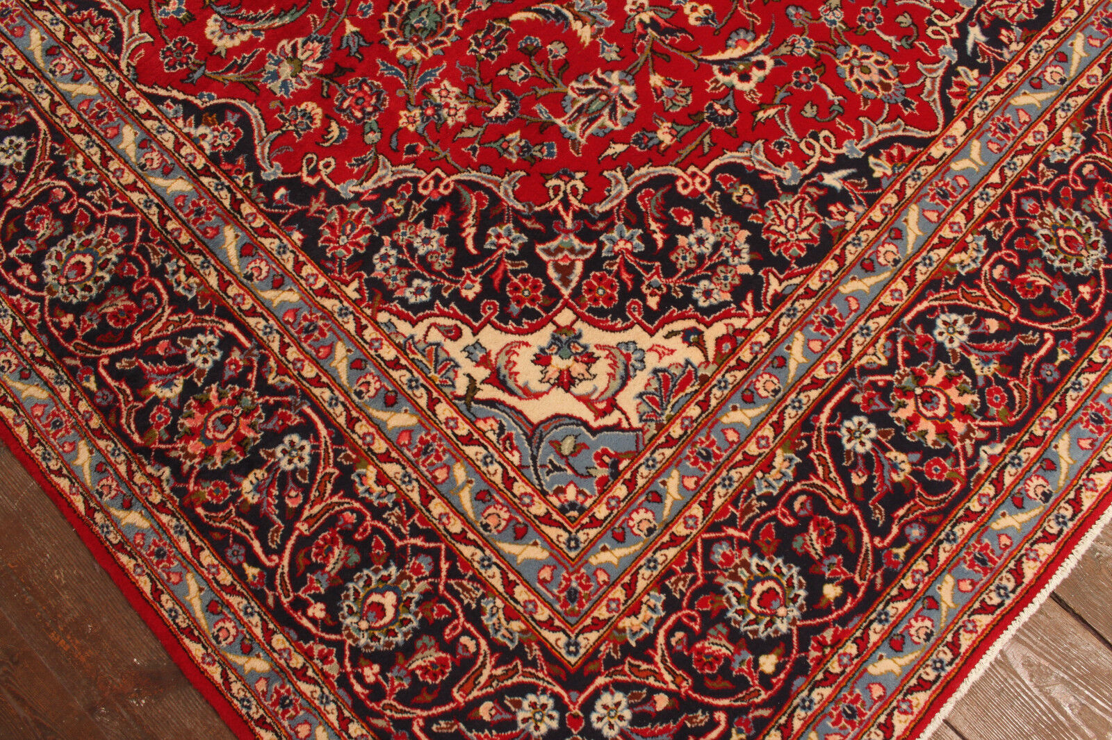 Close-up of the rich red color of the Handmade Vintage Persian Style Kashan Rug