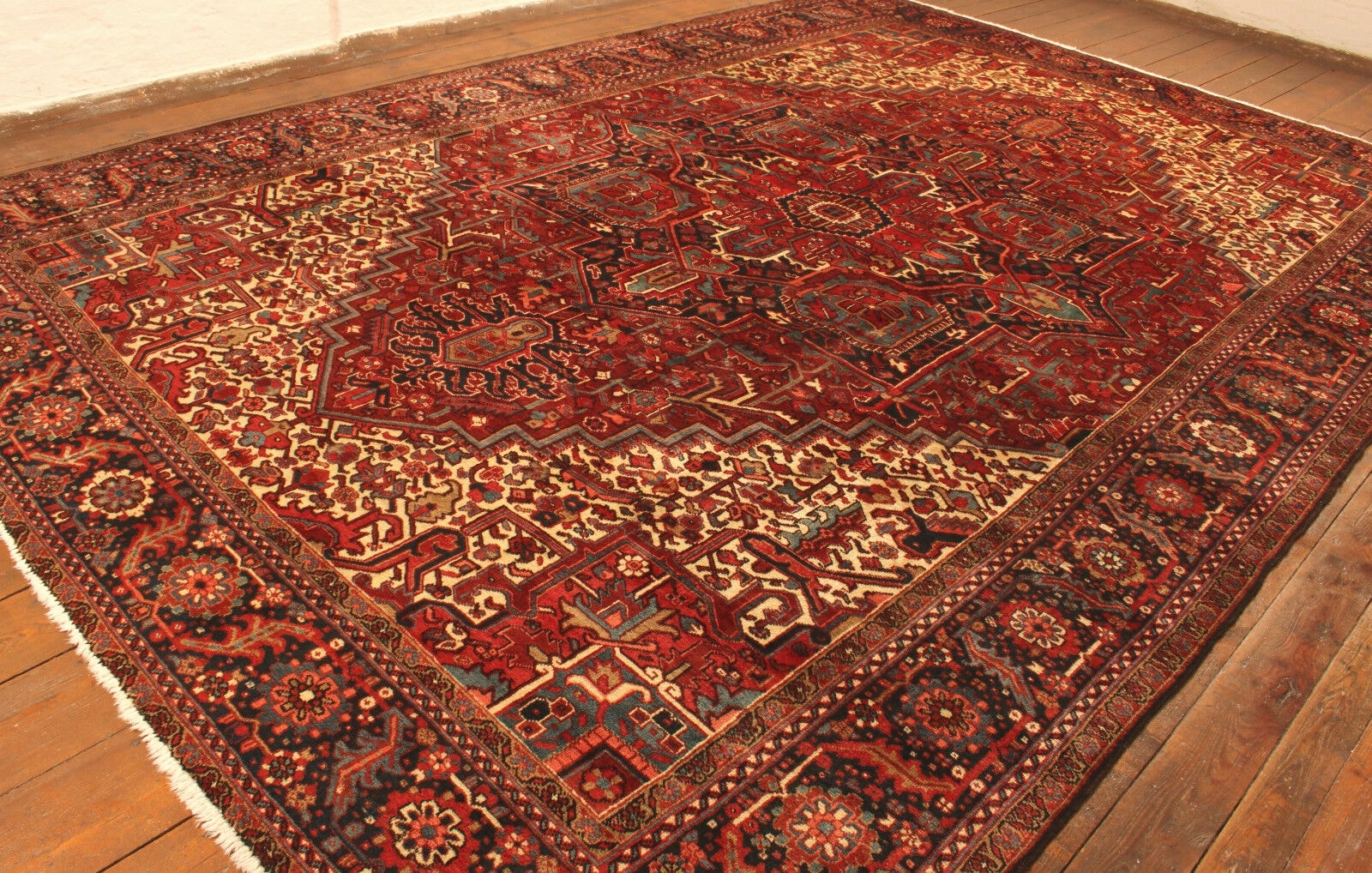 Detailed close-up of the rich history depicted in the Handmade Vintage Persian Style Heriz Rug