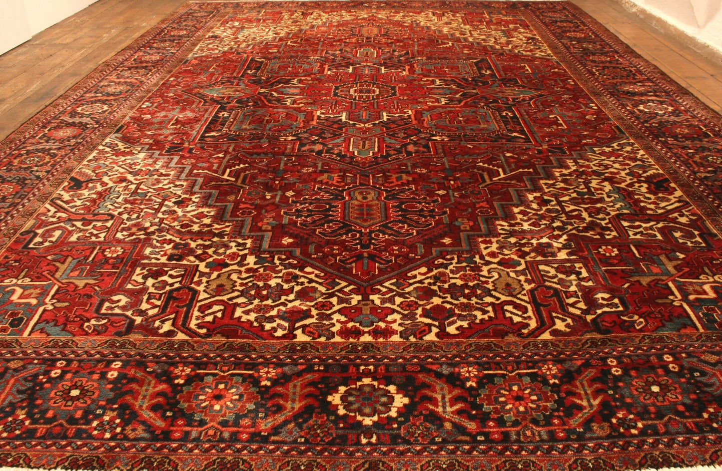 Side angle shot of the Handmade Vintage Persian Style Heriz Rug showcasing size and scale