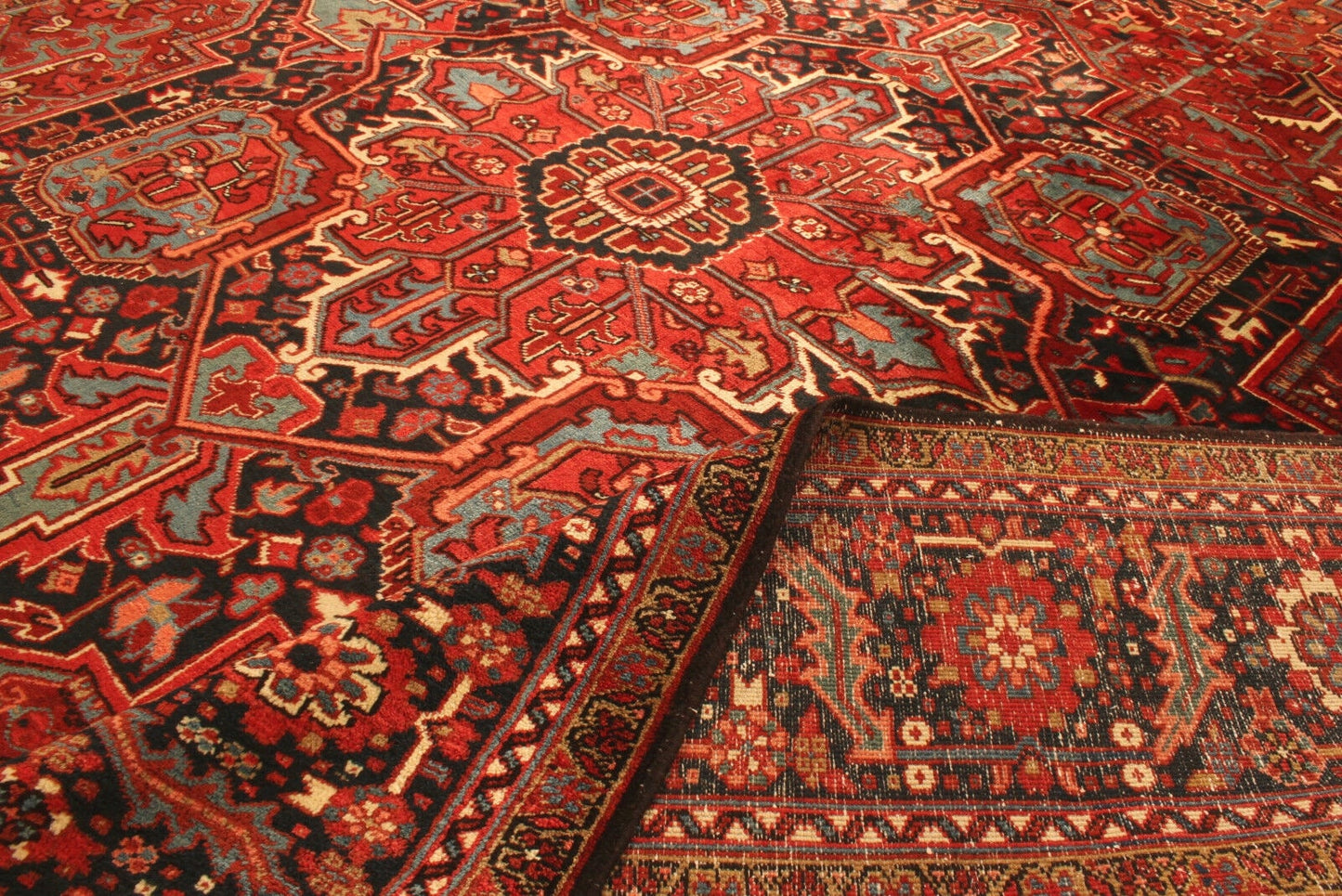 Front view of the Handmade Vintage Persian Style Heriz Rug highlighting design elements