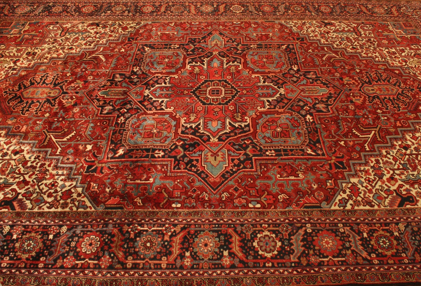 Angled shot of the Handmade Vintage Persian Style Heriz Rug complementing furniture
