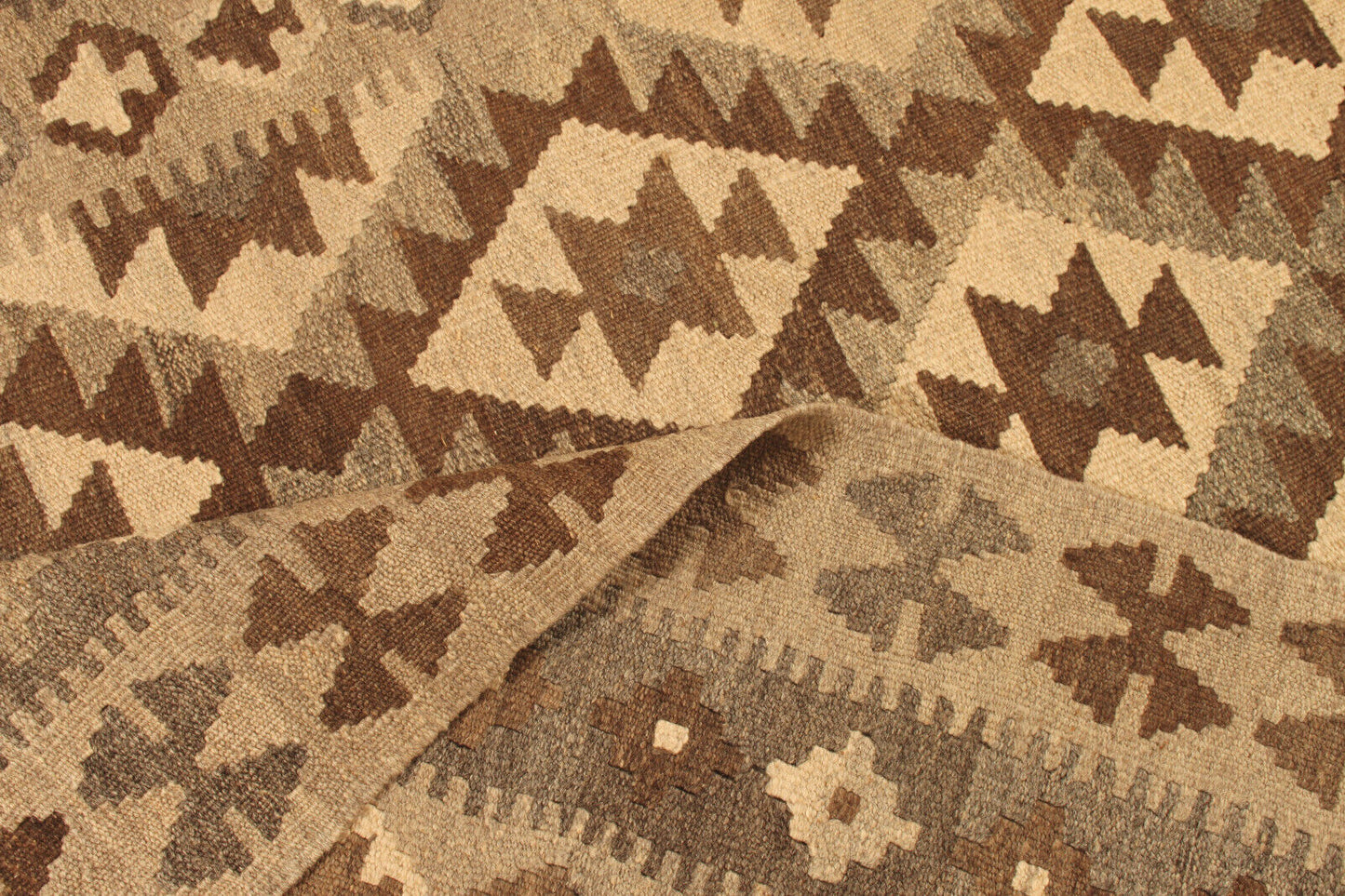 Close-up of the beige and brown shades on the Handmade Vintage Afghan Flatweave Kilim