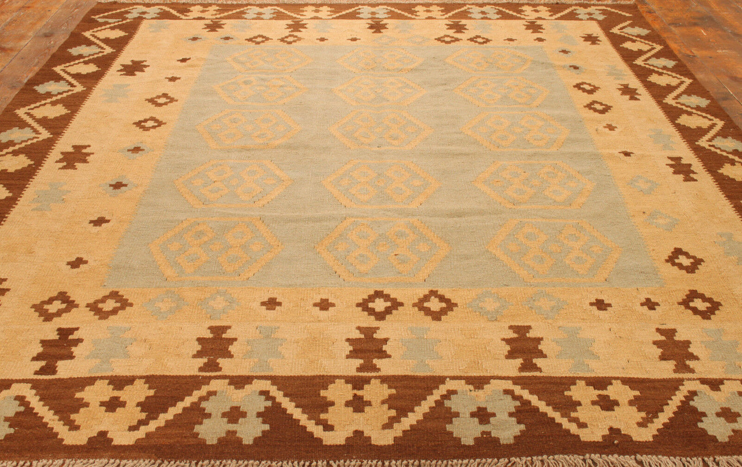Close-up of the shades of grey, beige, and brown on the Handmade Vintage Afghan Flatweave Kilim