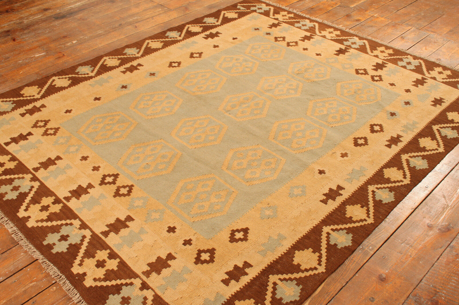 Angled shot of the Handmade Vintage Afghan Flatweave Kilim complementing furniture