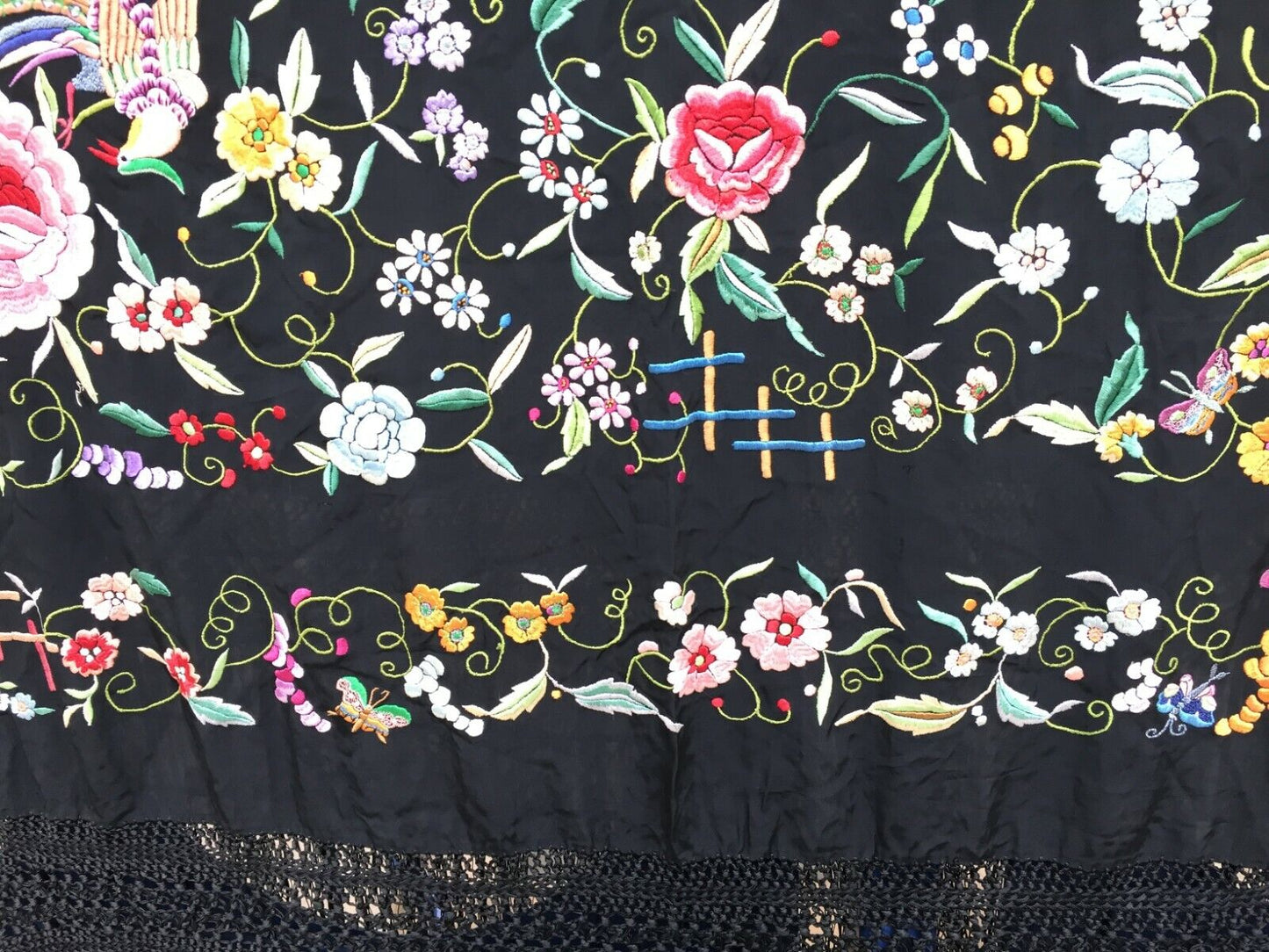 Close-up of the floral motifs woven onto the cotton base, highlighting their intricate details
