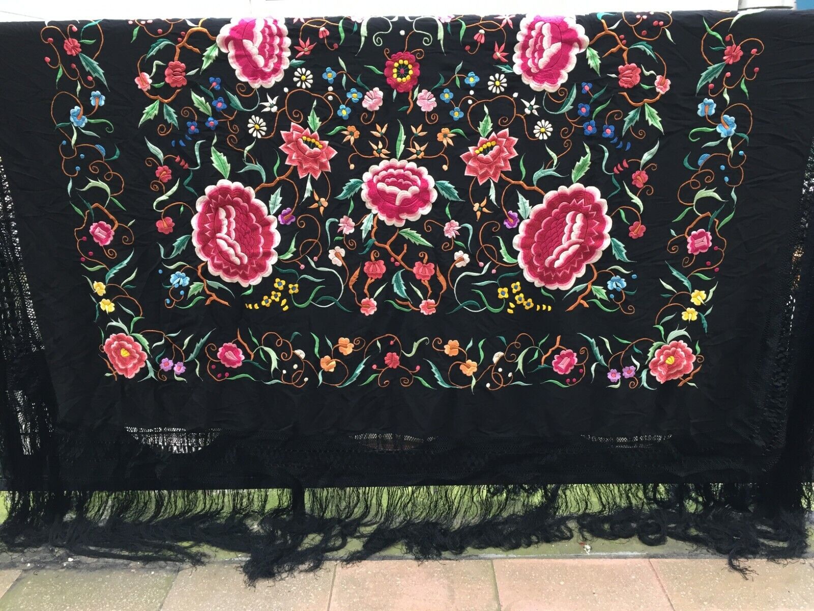 Side angle view of the shawl, highlighting its thickness and luxurious texture