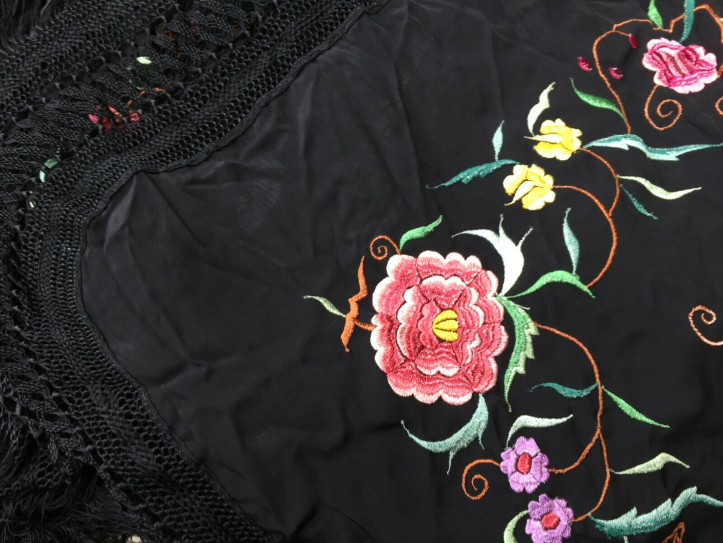 Close-up of the detailed floral patterns woven into the silk fabric