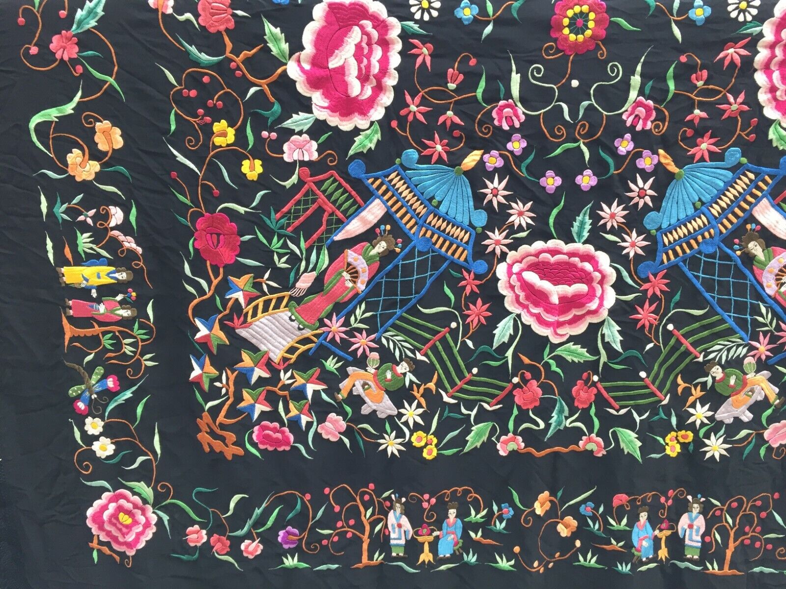 Side view of the shawl displaying its fringe and overall thickness