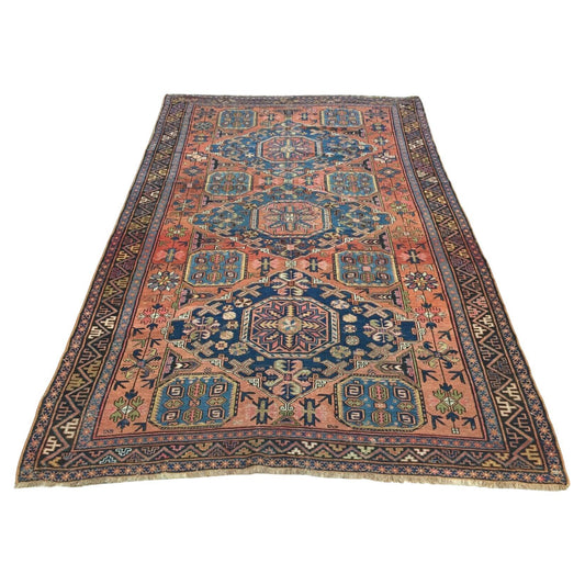 Handmade Antique Persian Sumak Rug featuring intricate geometric and floral designs in blue, red, and beige hues