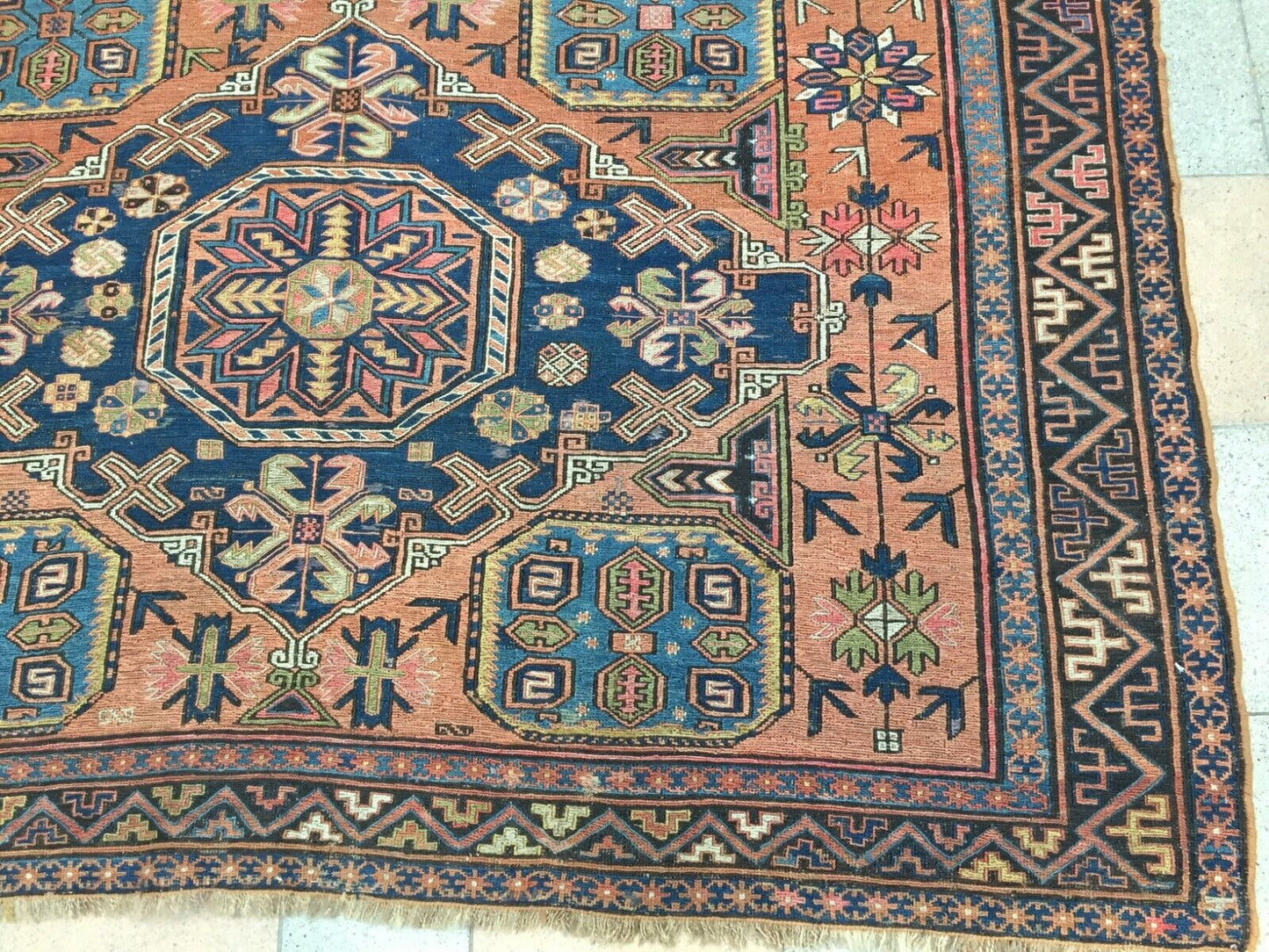 Side angle view of the rug, capturing its size and vibrant colors
