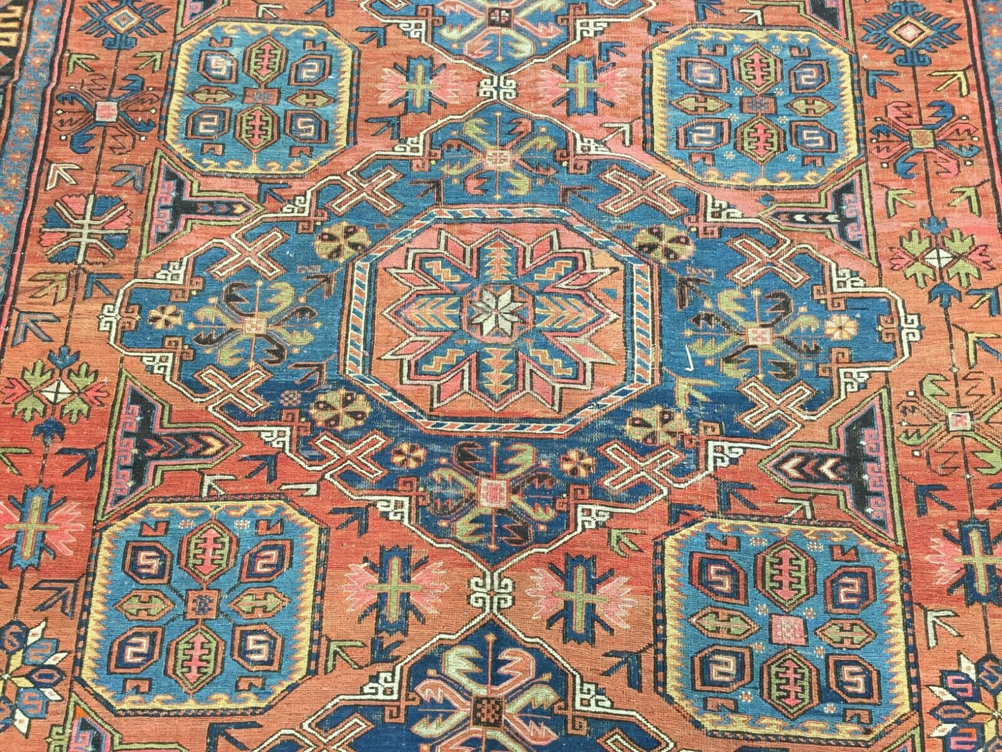 Overhead shot of the rug displaying its symmetrical layout and attention to detail