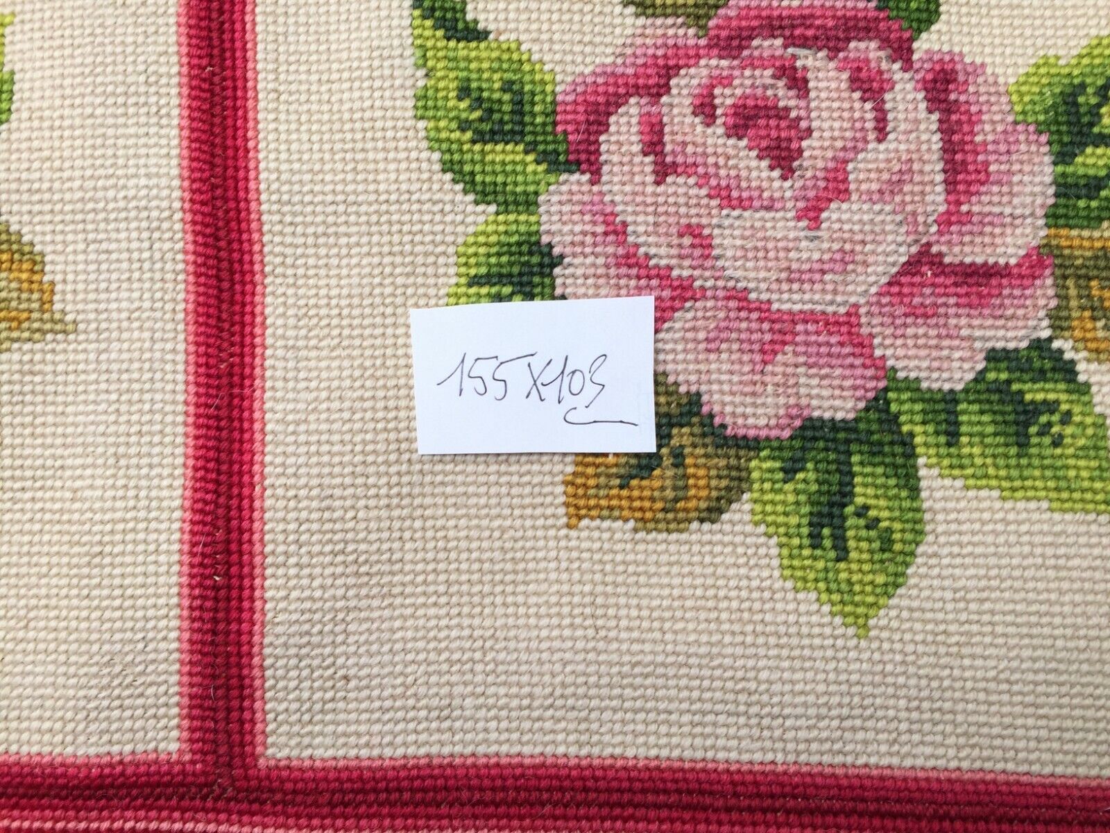 Front view of the rug hanging elegantly, capturing its full dimensions and design