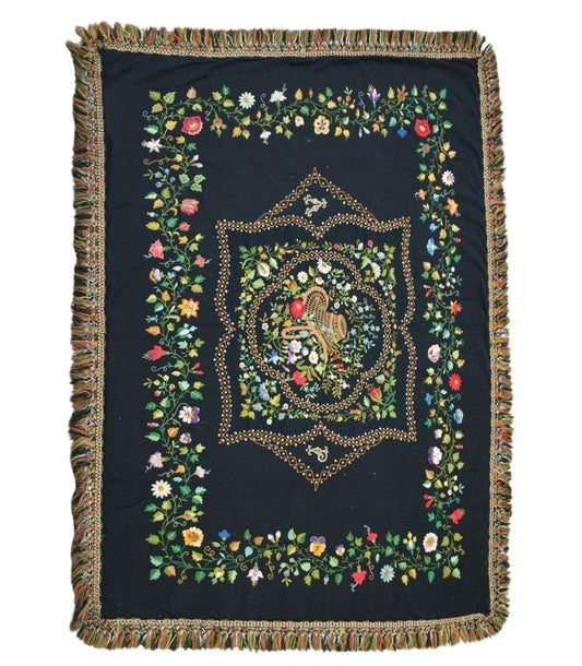 Handmade Antique French Needlepoint Rug showcasing intricate floral designs on a dark background, with a detailed centerpiece surrounded by geometric patterns and thick fringe along the edges