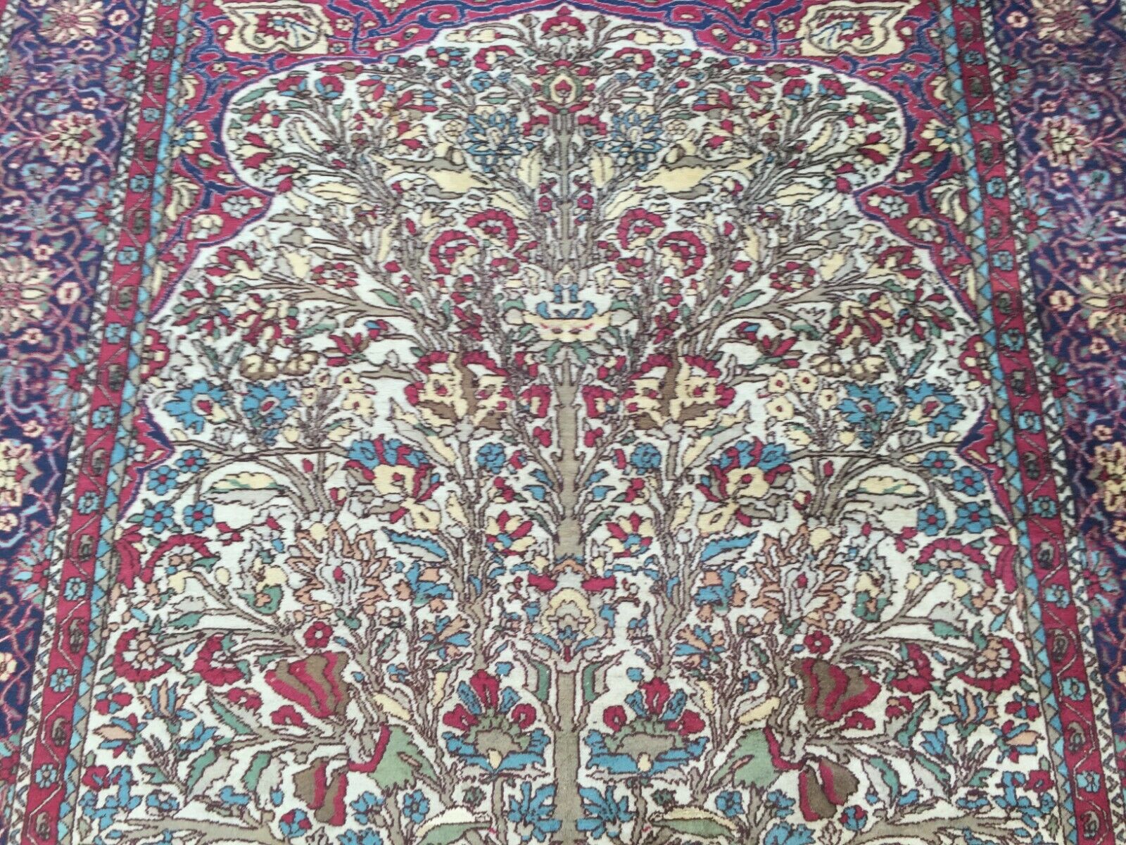 Animals Woven into Fabric Adding Depth and Symbolism on Antique Kerman Rug - 1920s